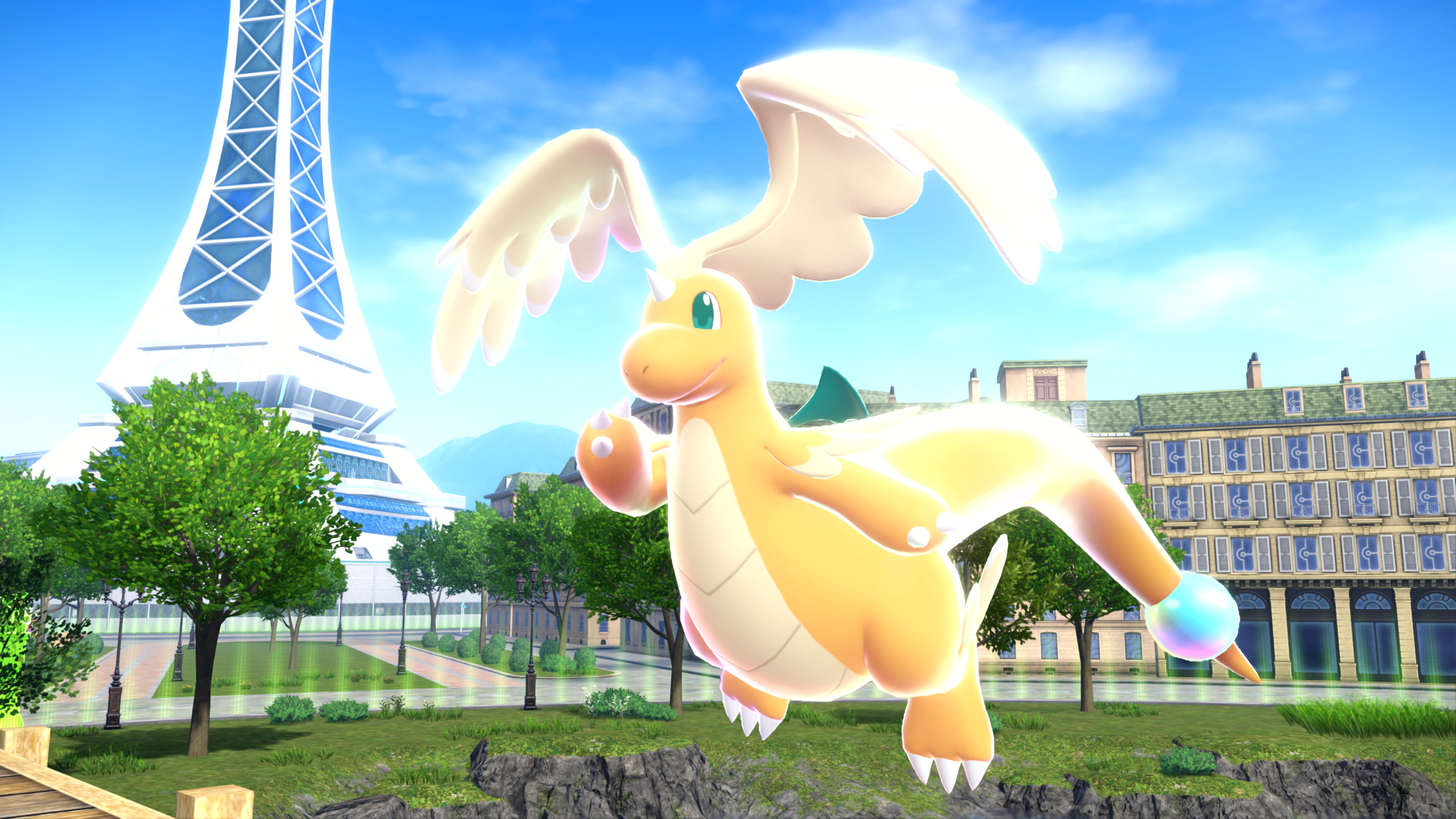 Mega Dragonite glows with power in front of the Lumiose City Prism Tower in Pokémon Legends: Z-A, showcasing the return of Mega Evolution.