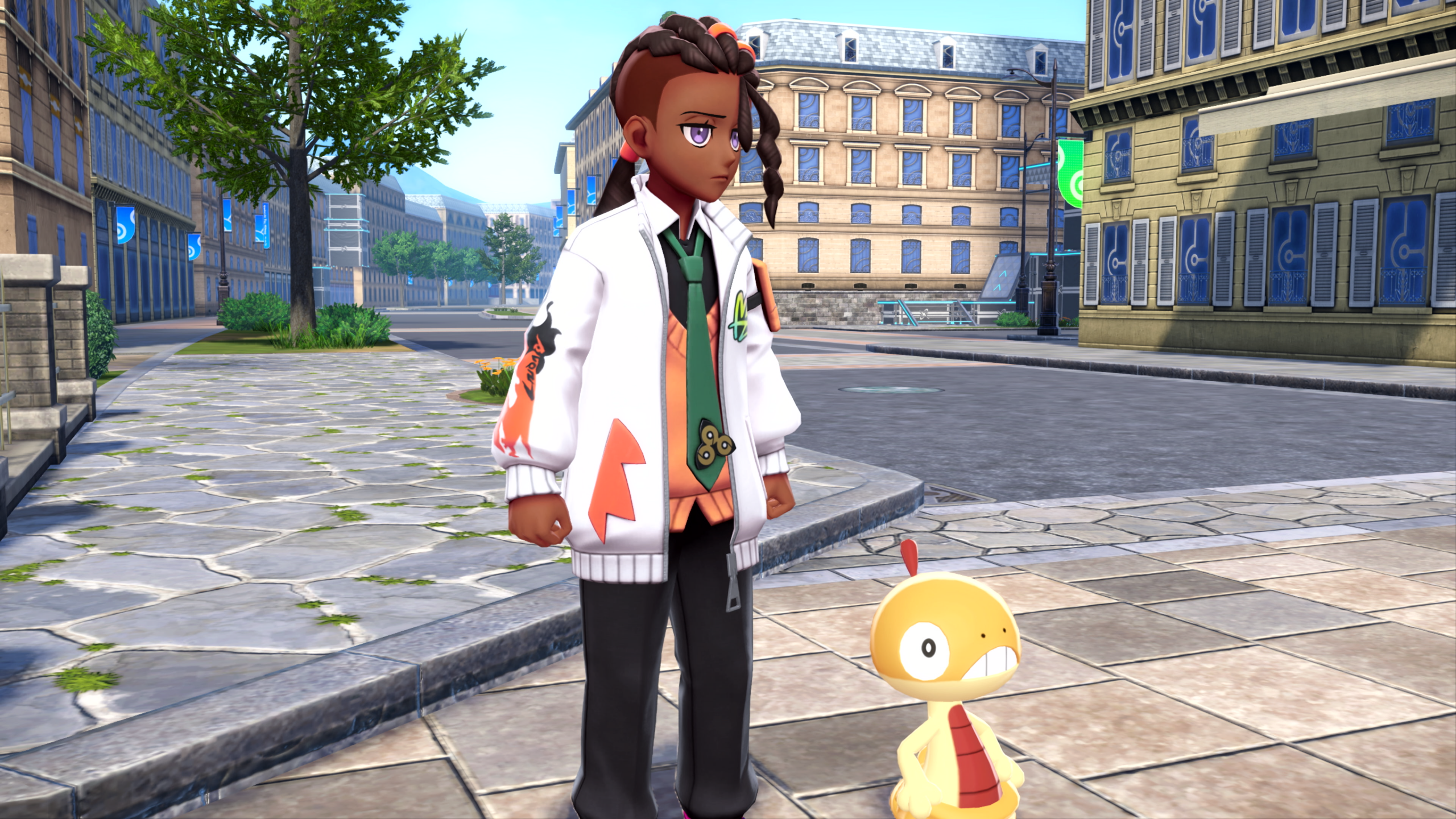 New character Naveen stands in Lumiose City alongside Scraggy in Pokémon Legends: Z-A, showcasing a redesigned urban environment and original character design.
